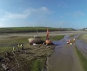 Removal of the wreck of the Motor Fishing Vessel (MFV) Sanu situated in the Gannel estuary, North Cornwall by the National Trust. The contractors had to carry out the work between tides and retain certain parts for Maritime Archeology Sea Trust projects.