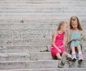 Get 100&#39;s of FREE Video Templates, Music, Footage and More at Motion Array: http://bit.ly/2SITwWM nnnGet this here: https://motionarray.com/stock-video/sisters-183585nnThe Sisters stock video is a fine piece of video that displays two beautiful little girls wearing pretty teal and pink dresses and looking at a map while sitting on gorgeous stone steps outdoors. This 1920x1080 (HD) bit of video is suitable to use in any project that has to do with travel, kids and fashion. Get your hands on this