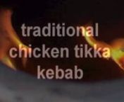 Cooking a tandoori chicken kebab in a tandoori oven