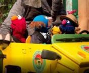Elmo welcomes the viewer, when Grover pulls up in his ATV, calling for people to join his