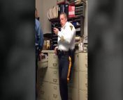 In a video inside Mountainside Police headquarters, Lt. Thomas Murphy (white shirt) encourages Detective Sgt. Andrew Huber (blue shirt) as he smacks a man with a large blue dildo.