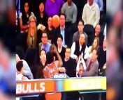 Father reacts quickly and saves his daughter from harm when a Bulls&#39; player dives into the stands.