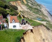 An 18th century farmhouse left hanging perilously over a cliff edge due to coastal erosion is being demolished today (May 10).&#60;br/&#62;&#60;br/&#62;Dramatic photos show the old farmhouse at Cliff Farm in Trimingham, Norfolk being knocked down after it was left dangling over the cliff in a precarious position.&#60;br/&#62;&#60;br/&#62;The three-bedroom home was bought at auction five years ago for £132,000 but coastal erosion left the back part of the home exposed after recent landslips in April.&#60;br/&#62;&#60;br/&#62;The homeowner decided to evacuate and today North Norfolk District Council demolished the property to stop it plunging onto the beach below.&#60;br/&#62;