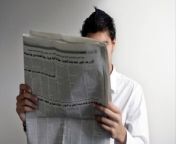 A new study has found that newspaper readers are considered to be more attractive than those seen reading books or staring at their phones in public.