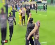WATCH: Oleksandr Zinchenko intervenes when guard stops fan rushing the field from rusher