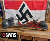 Police were called after an auctioneer hoisted a NAZI flag in his window to promote a World War Two sale.&#60;br/&#62;&#60;br/&#62;The flag, featuring a black swastika against the Austrian red-and-white triband, is going under the hammer on September 30.&#60;br/&#62;&#60;br/&#62;Saturday Auction House in Blackminster, Evesham, Worcs., expect it to fetch around £500.&#60;br/&#62;&#60;br/&#62;Auctioneer Trevor Williamson says the 3ft by 5ft flag was seized by British troops in World War Two and kept as a souvenir.&#60;br/&#62;&#60;br/&#62;The flag was passed down through the soldier&#39;s family before a relative decided to sell it.&#60;br/&#62;&#60;br/&#62;The upcoming auction has sparked controversy among locals after Mr Williamson put the flag in the shop window.&#60;br/&#62;&#60;br/&#62;Johanna Anderson, 44, was one of those who saw the flag on her way to a nearby spinning and weaving shop last Saturday (2/9).&#60;br/&#62;&#60;br/&#62;She said: “I pulled up on the car park, looked up and thought ‘wait, what?’&#60;br/&#62;&#60;br/&#62;“Someone I know came over and I had to ask if she was seeing the same thing as me. It was overlooking the car park and pretty hard to miss.&#60;br/&#62;&#60;br/&#62;“I have an elderly Jewish friend I meet there and was glad she wasn’t there that day as her family were killed in the holocaust.&#60;br/&#62;&#60;br/&#62;“It turns out the flag had been there a week already - she had seen it and had reported it to the police.&#60;br/&#62;&#60;br/&#62;“I don’t have family that were directly impacted but seeing it had a strong emotional impact on me. &#60;br/&#62;&#60;br/&#62;“If it was in a museum it would be different but this was completely without context.”&#60;br/&#62;&#60;br/&#62;The flag was removed on Monday (4/9) after a complaint was made to West Mercia Police.&#60;br/&#62;&#60;br/&#62;Mr Williamson said: “We have been instructed to sell the flag as part of an estate sale in the usual manner. &#60;br/&#62;&#60;br/&#62;“As auctioneers, we act as agents and do not uphold or subscribe to any political movement or regime.&#60;br/&#62;&#60;br/&#62;&#92;