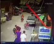 This is the shocking moment a heartless motorcyclist rides away after knocking over a schoolgirl. Sirintorn Charoenrum, 10, was crossing the road to reach classes when she was hit by a rider - travelling the wrong way down a one-way street - in Samut Prakan, Thailand. CCTV footage from a nearby grocery shop captured the moment the little girl was hit on Tuesday (24/09) morning. Sirintorn was flung into the air and landed several metres away. Instead of stopping to help her, the rider fled. Onlookers rushed to help the girl whose mother, Uthaiwan , 31, arrived on the scene and collected her daughter.