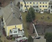A small plane is removed from the roof of an apartment block in Methuen, Massachusetts. Its 73-year-old pilot died in the crash. Report by Matt Blair.