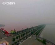 An ancient salt lake near the north China city of Yuncheng, Shanxi province, has recently turned red on one side, making it a famous tourist destination.
