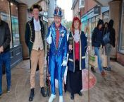 Petersfield Town Crier surprised shoppers on a rainy Bank Holiday Monday by giving a Royal Proclamation to mark the first anniversary of the Coronation of King Charles III. She was accompanied by husband and deputy town crier, Martin, and &#92;