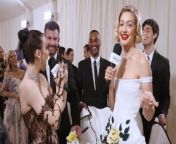 Gigi Hadid talks with Emma Chamberlain at the 2024 Met Gala about what she loves about the Met Gala and her stunning beaded Thom Browne dress.